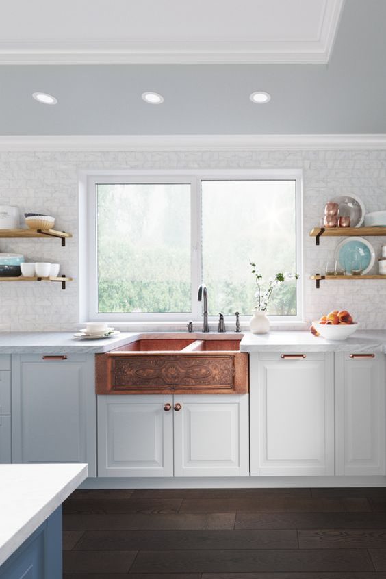 Copper sink in a white kitchen unit