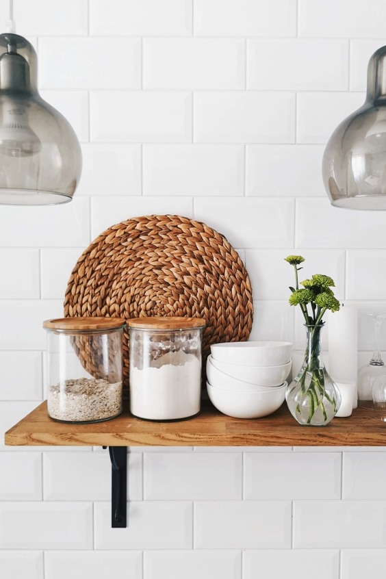 White kitchen tiles with wooden shelve