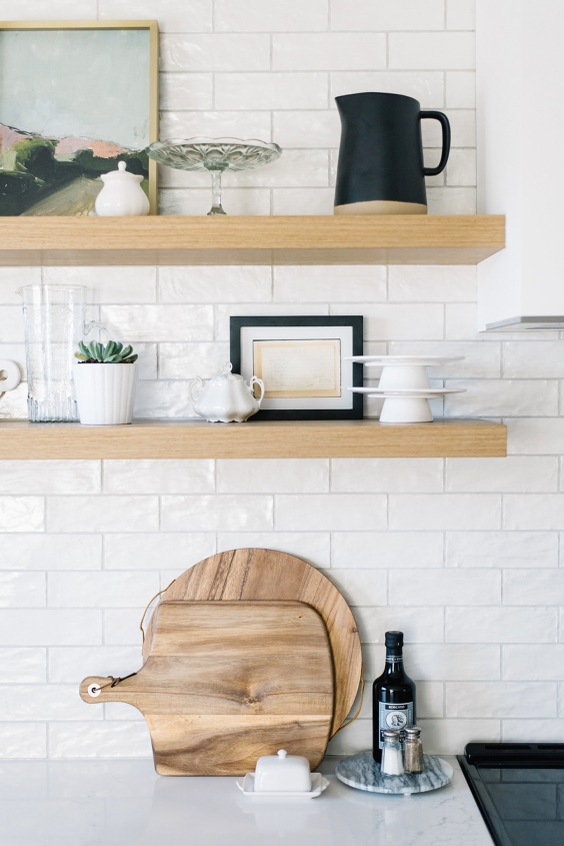 Little picture on a shelve in a white kitchen